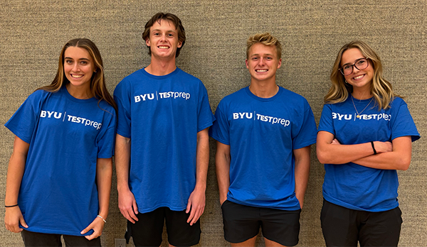 group of counselors in blue BYU Test Prep shirts posing for the camera
